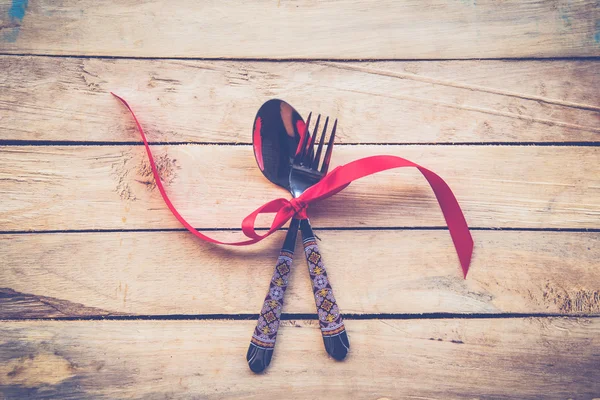 Valentines dinner on wooden background with space. Vintage style