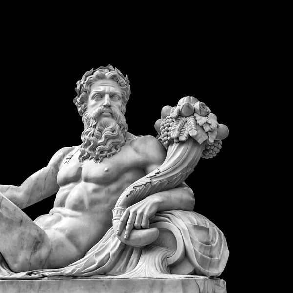 Marble statue of greek god with cornucopia in his hands.