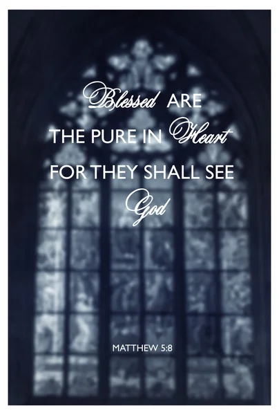 Inspirational religious quote with words Blessed are the pure of heart on background of stained-glass window inside the church.