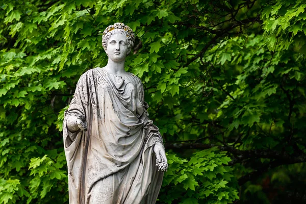 Marble statue of roman Ceres or greek Demeter in the park of the Palace and park complex Estate of G. Galagan. Sokyryntsi village, Ukraine.