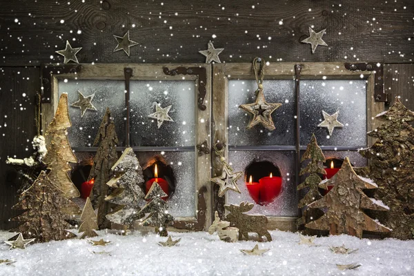 Mood and atmosphere: christmas window decoration in red with woo