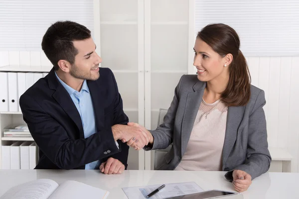 Business talk with shaking hands: counselor and customer or hell