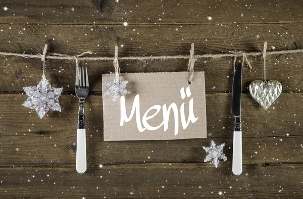 Christmas menu card for restaurants with knife and fork on woode