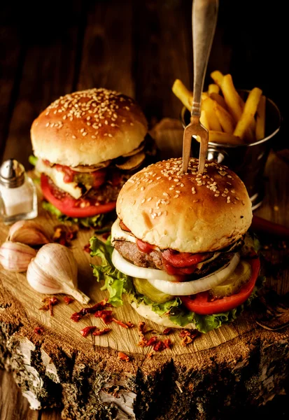 Homemade hamburger with lettuce and cheese.