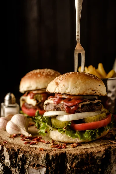 Homemade hamburger with lettuce and cheese.