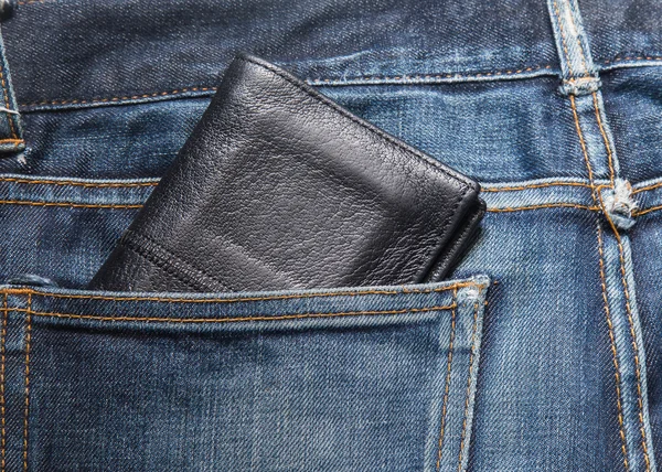 Jeans texture , Blue denim jeans with black lether wallet (focus on wallet)