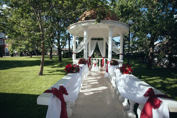 Wedding. Wedding ceremony. Arch.Rotunda. Arch, decorated with re