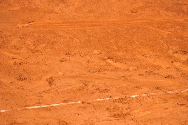 Footprints on a tennis clay court