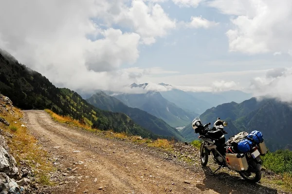 Adventure motorcycle on a dirt road in northern Albania