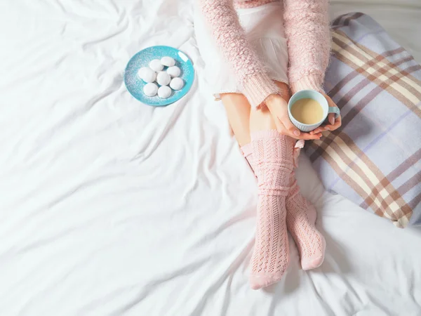 Woman relaxing at cozy home atmosphere