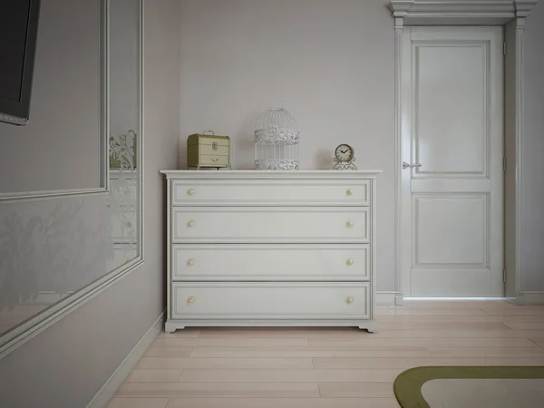 White dresser in bedroom with cream walls