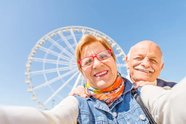 Senior couple taking selfie