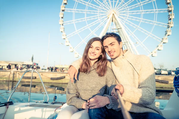 Couple sailing on boat