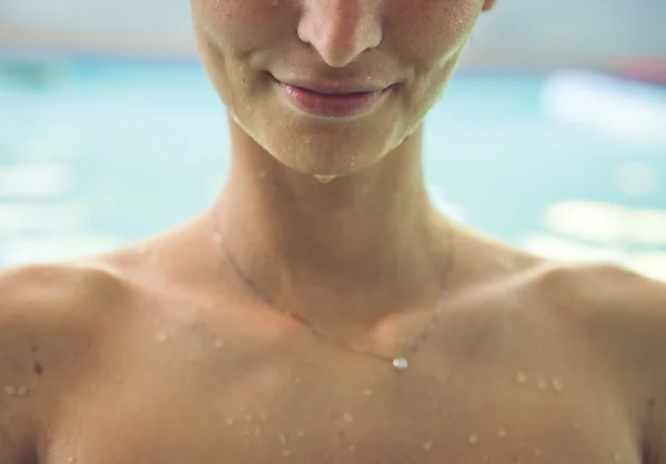 Close up on woman face in the swimming pool