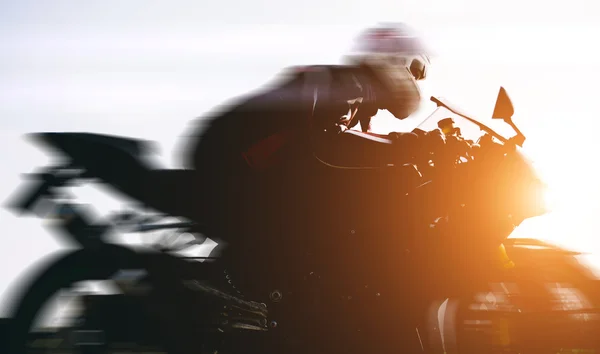 Fast biker driving on the street