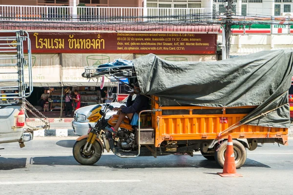 CHIANGRAI, THAILAND - OCT 31 : people and vehicle waiting to pas