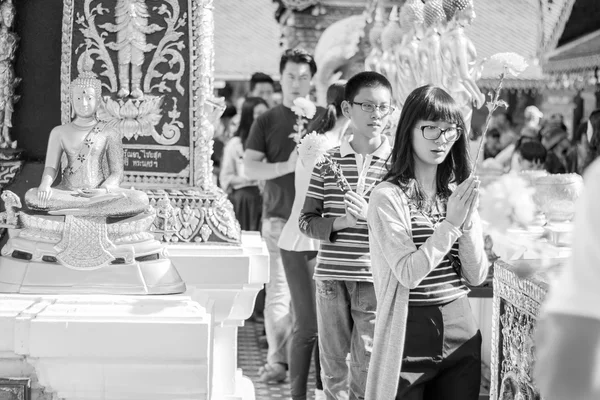 Chinese tourist pray for endless happiness and health