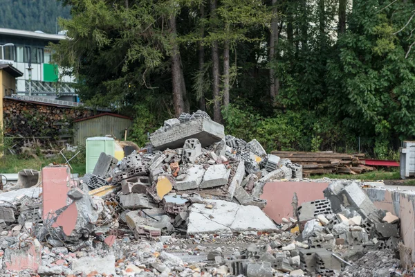 Heap of broken bricks and concrete on demolition site