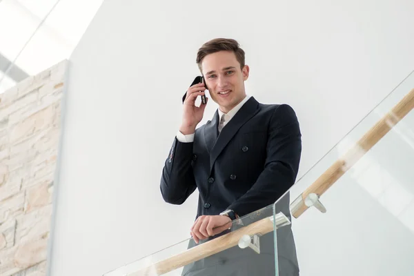 Young businessman with phone