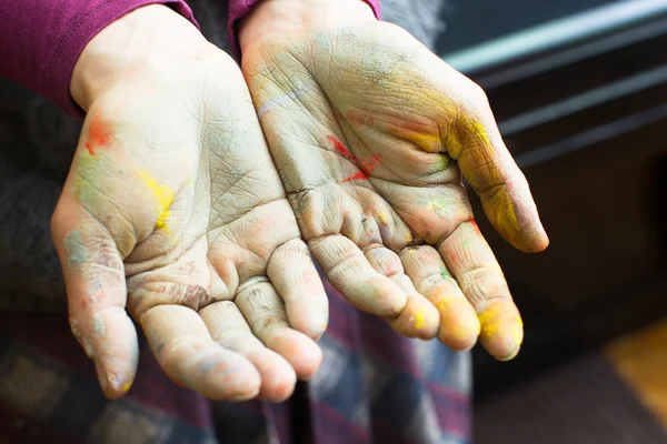 Hands stained with clay and paint. Hands painter and sculptor. C