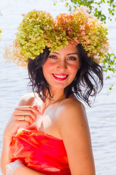 Young Russian woman on her head a wreath of flowers hydrangeas,