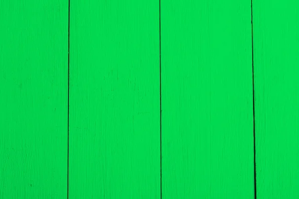 Green boards, a wooden background