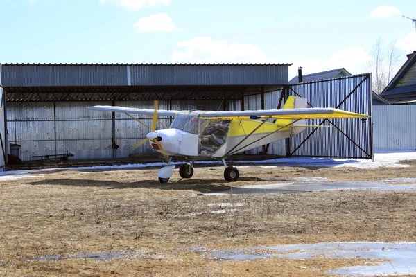 Small plane near hangar