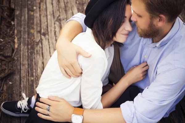 Beautiful hipster couple in love on a date outdoors in park havi