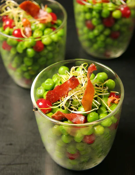 Peas with ham, red fruits and bean sprouts