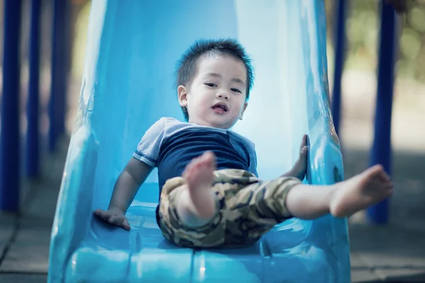 Asian boy in amusement park