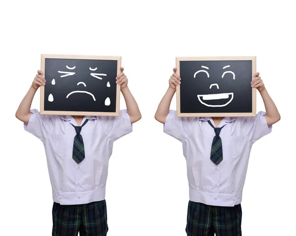 Sad and happy schoolboy with chalkboard