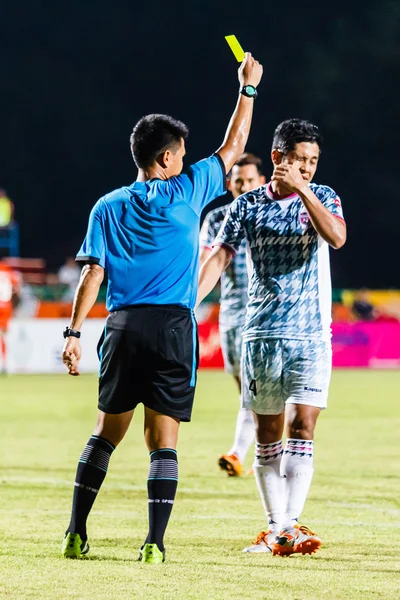 SISAKET THAILAND-JULY 6: The referee (blue) show the yellow card