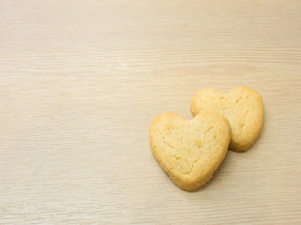 Heart cookies on wood background