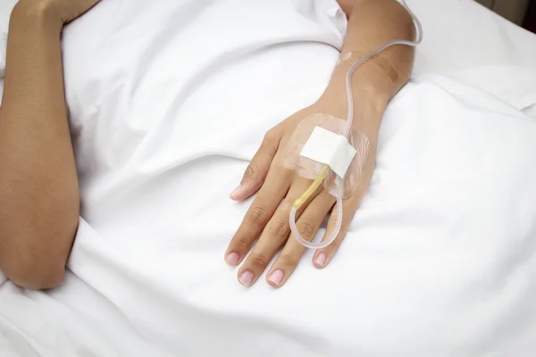 Patient in hospital with saline intravenous (iv)