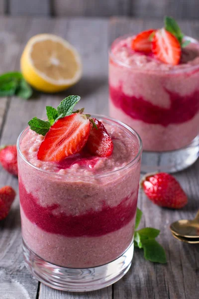 Overnight oatmeal with fresh strawberry in glass beaker