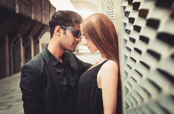 Young trendy man and woman in love passion emotions of the modern street. Fashion Style