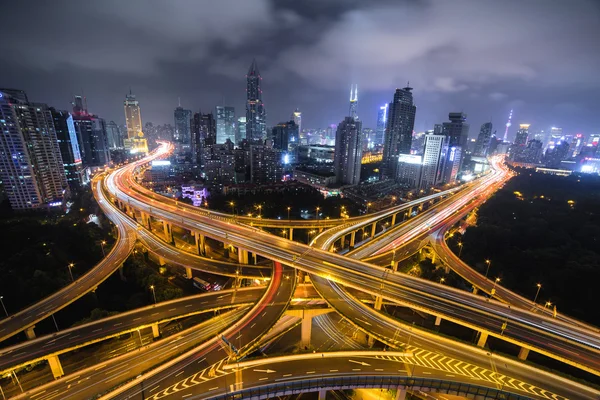 Modern city traffic road at night. Transport junction.