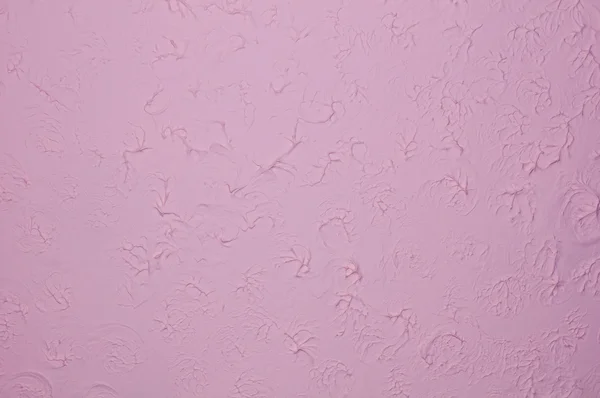 Purple wall with plaster relief