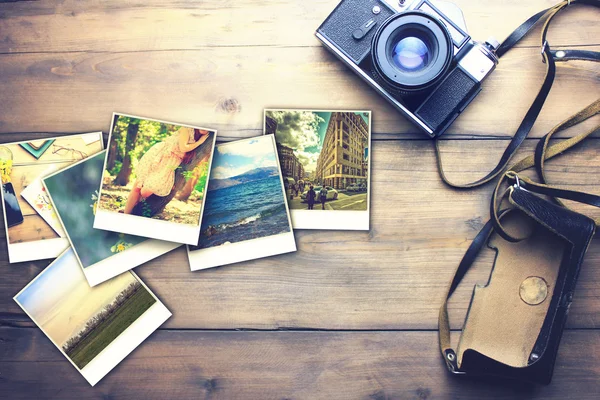 Camera and photos on table