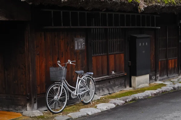 Classic bicycle park next to wooden wall in Japan