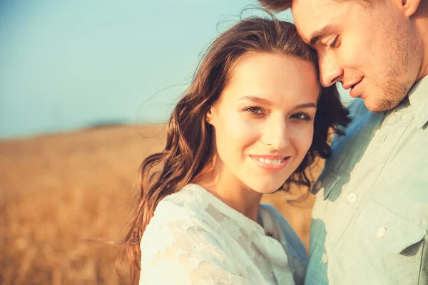 Young couple in love outdoor.Stunning sensual outdoor portrait of young stylish fashion couple posing in summer in field