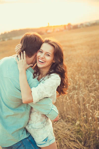 Young couple in love outdoor.Stunning sensual outdoor portrait of young stylish fashion couple posing in summer in  field