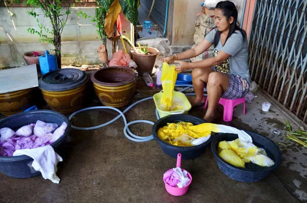 Thai women washing and clean clothes after tie batik dyeing natu