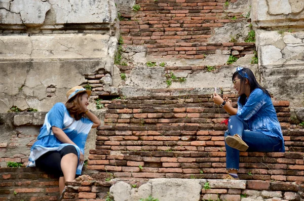 Thai women portrait at ancient building at Wat Mahathat