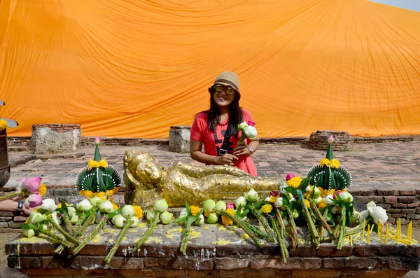 Thai woman portrait and pray with Reclining Buddha