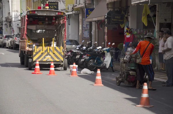 Thai man working mark line thermoplastic traffic routes on the r