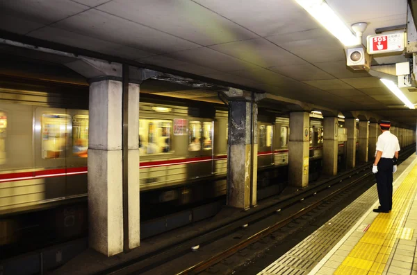 Japanese station master working at Subway train