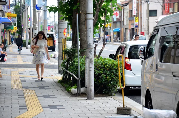 Japanese women walking to subway station