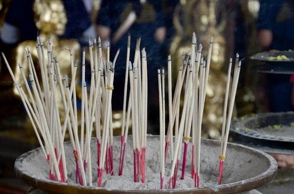 Thai people pray with flower, joss stick and candle for Buddha s