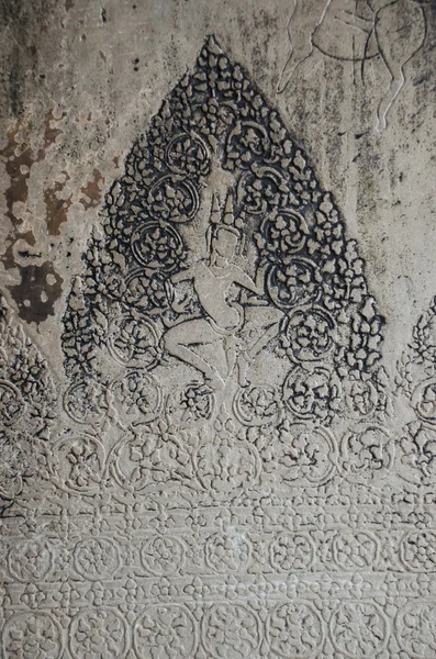 The beautiful ancient carving on the stone at Angkor wat